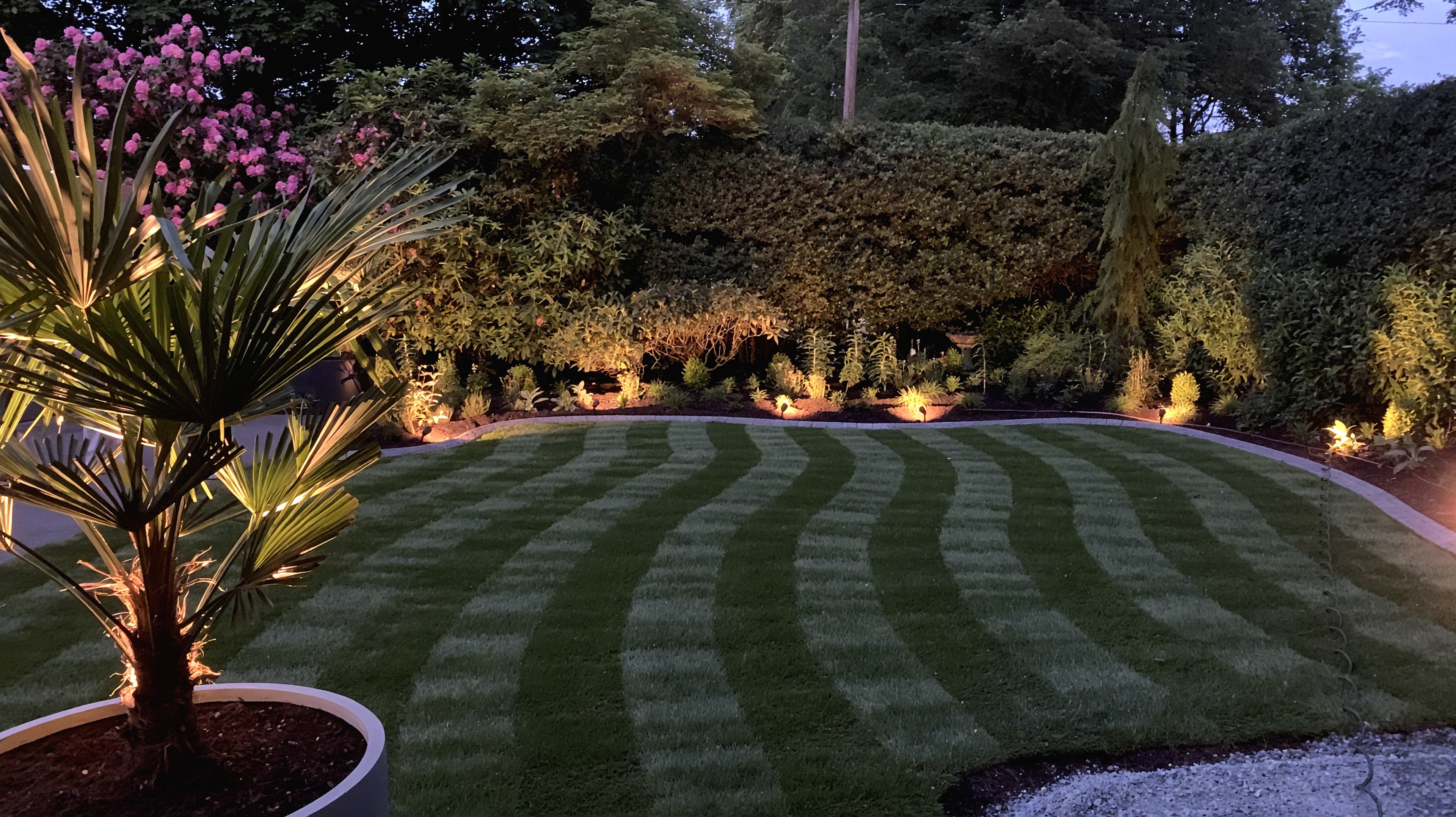 Sod lawn, Outdoor Lighting, Putting green and Concrete walkway at the Cartier St project.